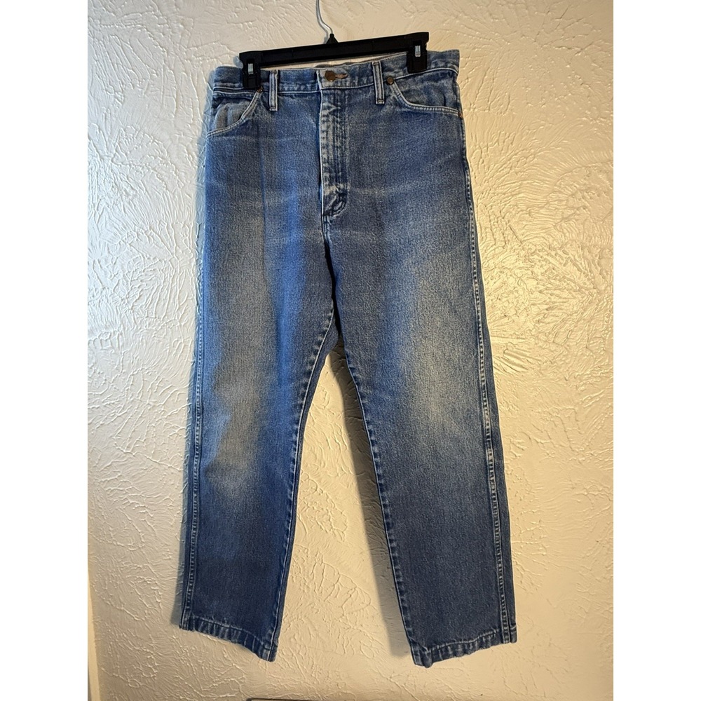 Wrangler men's jeans in a classic light blue denim wash with a straight-leg fit.